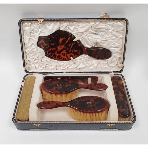 210 - Asprey gold inlaid simulated tortoiseshell dressing table set of six pieces viz:- hand mirror, pair ... 