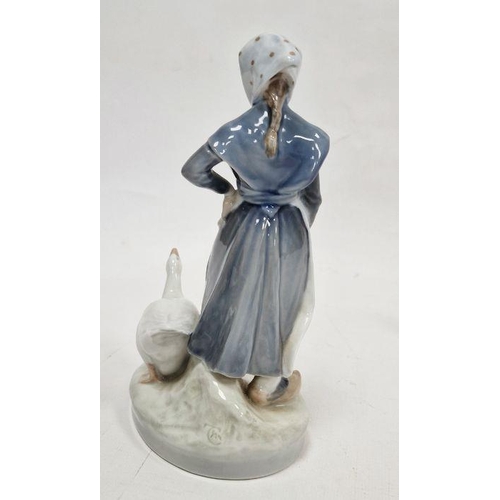 42 - Royal Copenhagen figure of girl attending a goose, with blue wave marks, pattern no.528, on oval bas... 