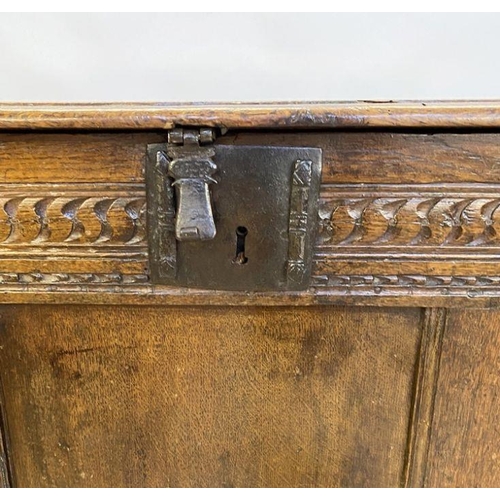 1073 - Large antique oak coffer having quadrant mould edge, scroll carved frieze, triple framed panel front... 