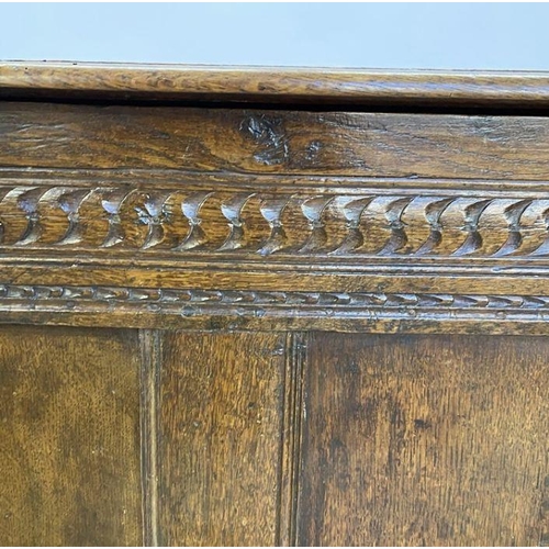 1073 - Large antique oak coffer having quadrant mould edge, scroll carved frieze, triple framed panel front... 