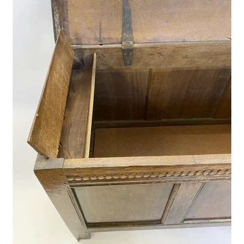 1073 - Large antique oak coffer having quadrant mould edge, scroll carved frieze, triple framed panel front... 