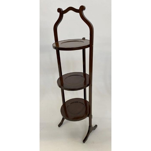 1120 - Mahogany three-tier folding cake stand, a stained wood folding three-tier airer with turned finials ... 