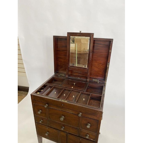 1188 - Georgian mahogany campaign writing/vanity cabinet, the lift-up top revealing compartments and mirror... 