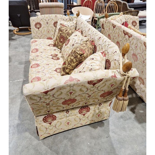 1203 - Knole drop-end sofa by Brights of Nettlebed, upholstered in a floral scrolling fabric on a cream gro... 