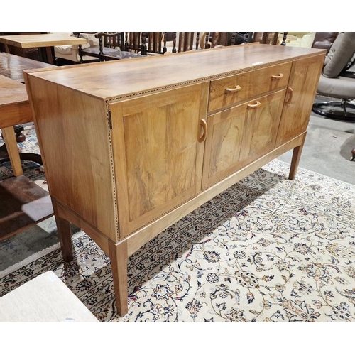 1237 - 1969/70 Oliver Morel Cotswold School walnut sideboard having slight raised edge to the back, central... 