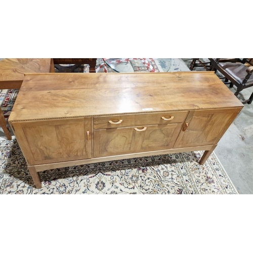 1237 - 1969/70 Oliver Morel Cotswold School walnut sideboard having slight raised edge to the back, central... 