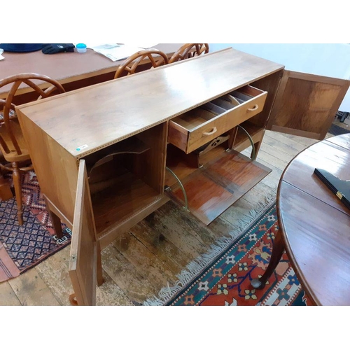 1237 - 1969/70 Oliver Morel Cotswold School walnut sideboard having slight raised edge to the back, central... 