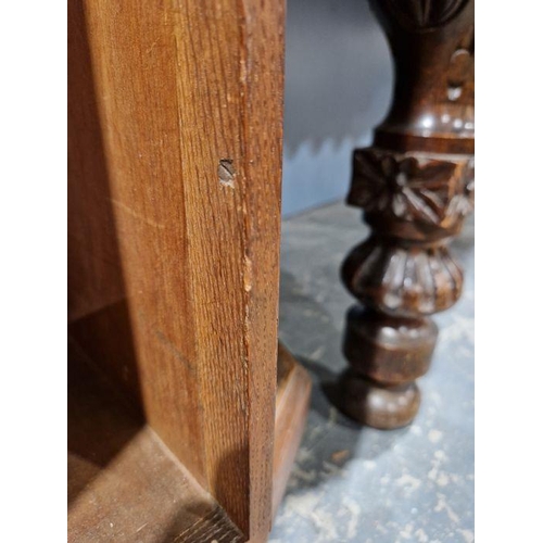 1243 - Early 20th century carved oak revolving bookcase of octagonal form, the four-side panels adourned wi... 