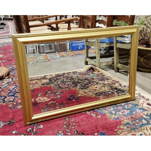 1254 - Modern gilt framed wall mirror of rectangular form with bevelled edged glass, 100cm long x 69cm high... 