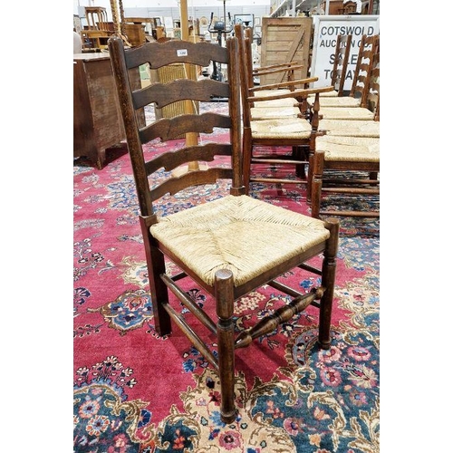 1258 - Set of 10 early 20th century oak ladderback rush seated dining chairs comprising eight standards and... 