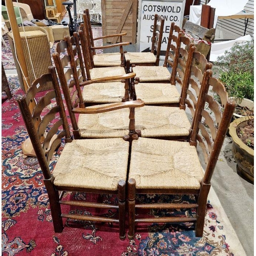 1258 - Set of 10 early 20th century oak ladderback rush seated dining chairs comprising eight standards and... 