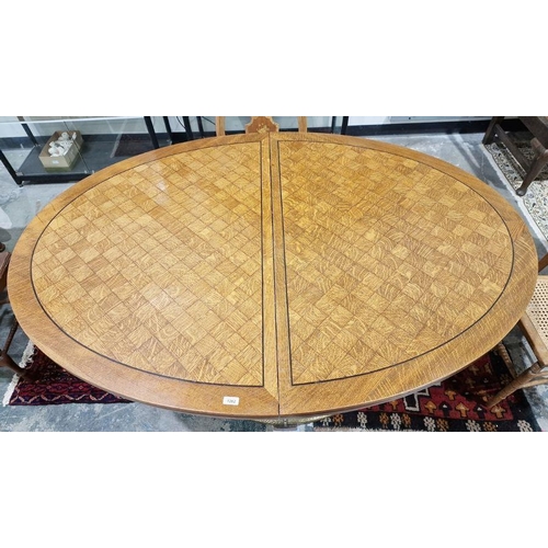 1262 - Austrian chequered oak oval dining table with ebony stringing, on oval curved panel column, hammered... 