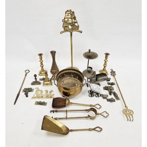 145 - Quantity brass fireside items to include candlesticks, warming pan