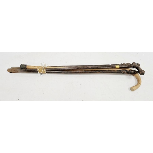 182 - Rosewood-effect walking stick with gilt metal collar, two African carved figure walking sticks, anot... 