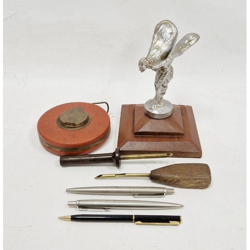 186 - 'Spirit of Ecstasy' car mascot mounted on a wooden base, two stainless steel Parker pen biros, two w... 