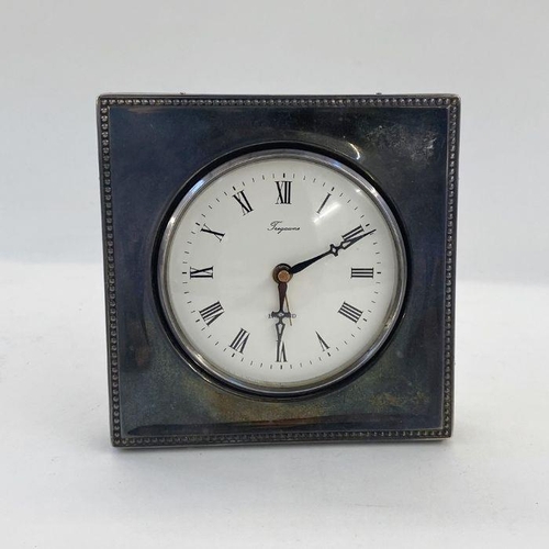 199 - Tregawne circular clock and silver mounted case, London 1984, 11cm wide