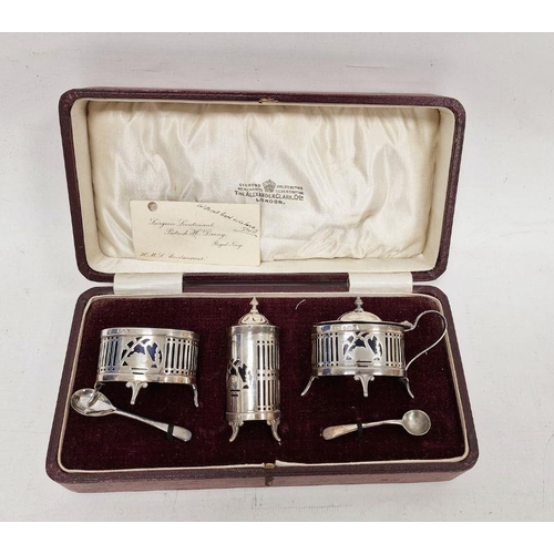 202 - Silver three-piece condiment set, each with gallery sides, on scroll tab feet, having blue glass lin... 