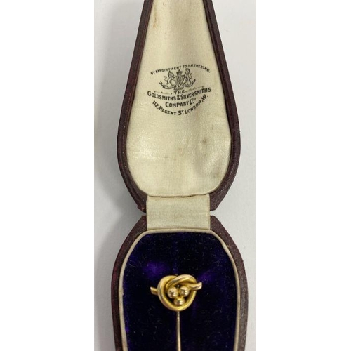 243 - Pair of gold coloured and tortoiseshell folding spectacles and a 15ct gold hat pin in a fitted case ... 