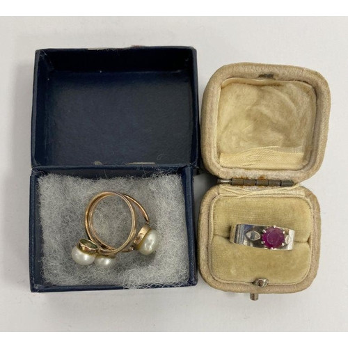 245 - WITHDRAWN Two gold-coloured rings set with pearls and a silver-coloured ring set with garnet-coloure... 