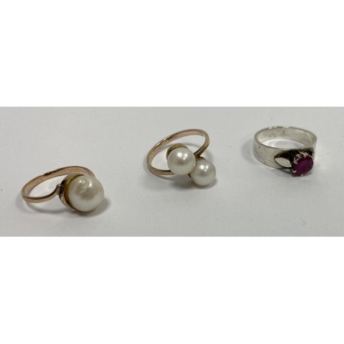 245 - WITHDRAWN Two gold-coloured rings set with pearls and a silver-coloured ring set with garnet-coloure... 