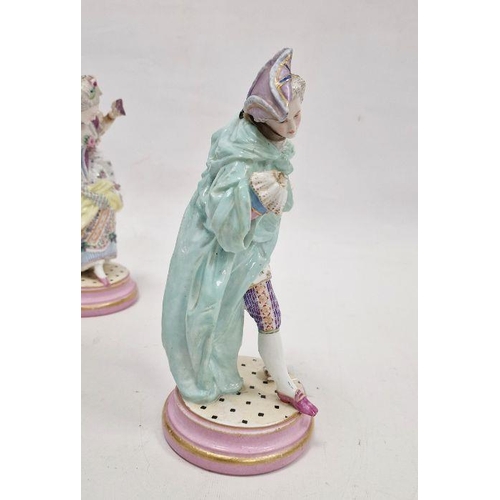 38 - Pair of Meissen-style porcelain figures of a lady and gallant, each on pink and gilt circular socle ... 