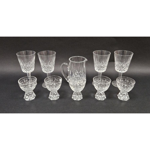 79 - Set of four Waterford cut glass wines, a Waterford cut glass jug and a set of five cut glass sherry ... 