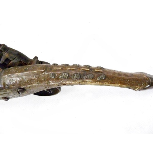 170 - Early 19th century Middle Eastern flintlock pistol, with ornately decorated handle and pommel, lengt... 