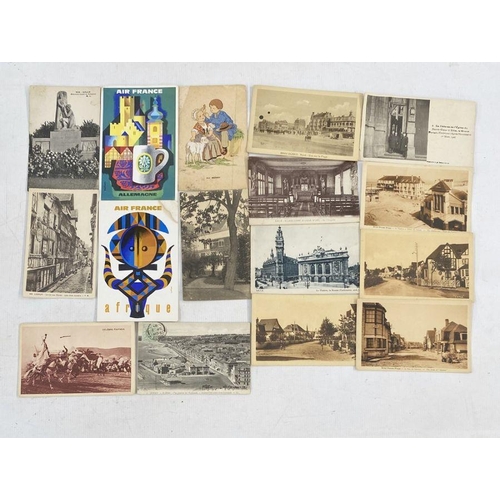 215 - French interest: early twentieth century postcards to include Lille, Paris, Bray-Dunes-Plage, Norman... 