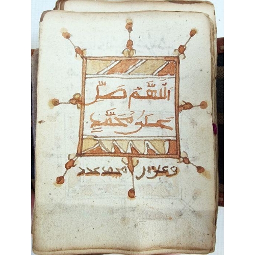 320 - Antique Quran - Arabic script in black and red, unbound but with signs of binding in the form of red... 