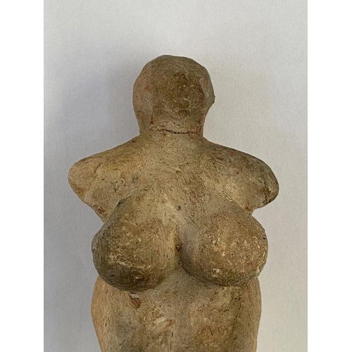 149 - Stone Age Venus idol with small cavity in the legs, 12cm x 6cm wide approx.