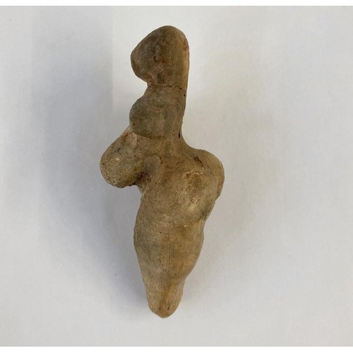 149 - Stone Age Venus idol with small cavity in the legs, 12cm x 6cm wide approx.