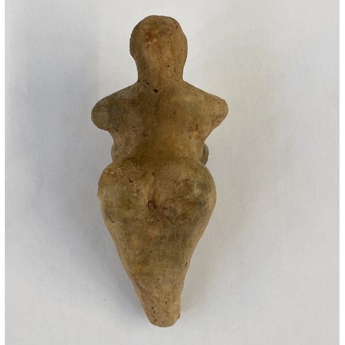 149 - Stone Age Venus idol with small cavity in the legs, 12cm x 6cm wide approx.