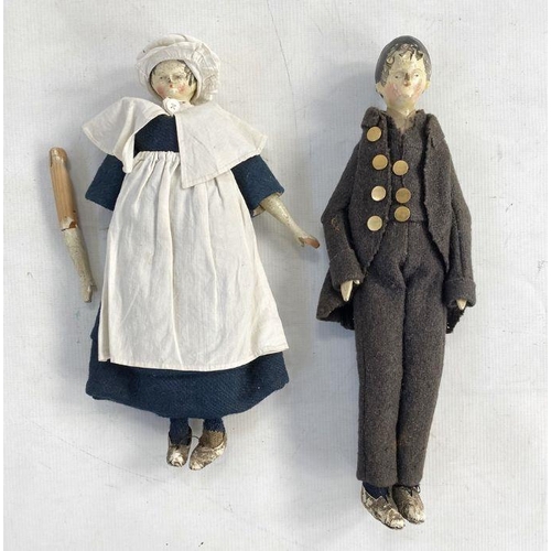 154 - Two possibly German peg dolls, male and female, the male with gold coloured buttons on a brown suit ... 