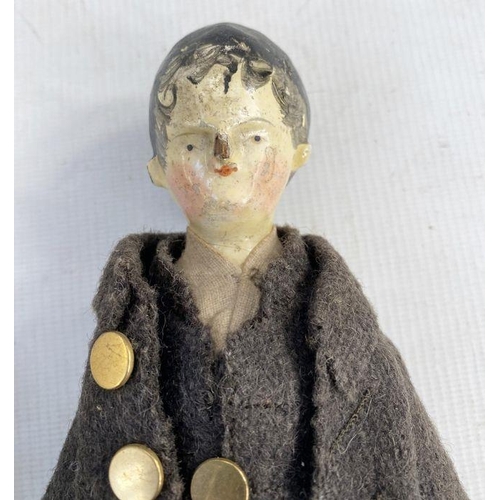 154 - Two possibly German peg dolls, male and female, the male with gold coloured buttons on a brown suit ... 