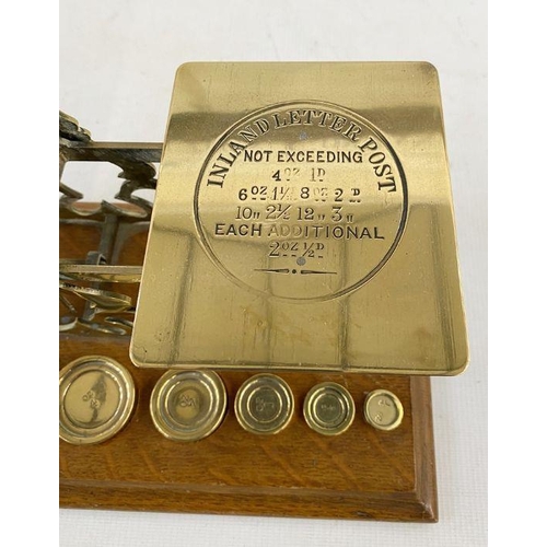 161 - Set of late 19th century Sampson Mordan and Co. postal scales, with seven graduated weights on oak p... 