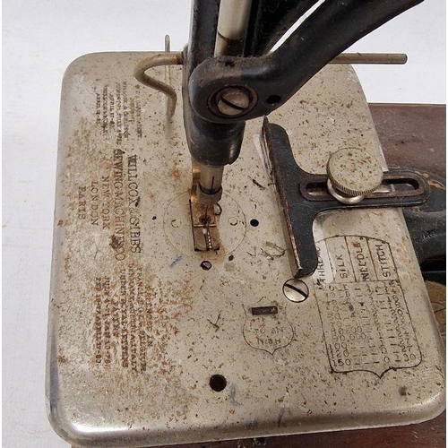 92 - Late 19th century Willcox & Gibbs sewing machine, 29cm high