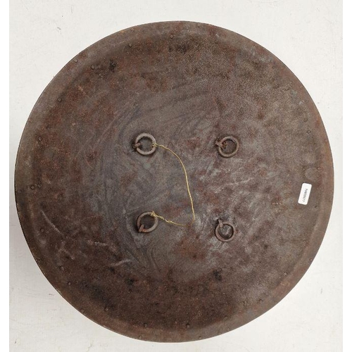 110 - Indian metal dhal/shield with etched scrolled decoration and four bosses, 26cm diameter approx.