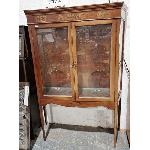 1242 - Early 20th century mahogany glazed display cabinet, the two doors opening to reveal two adjustable g... 