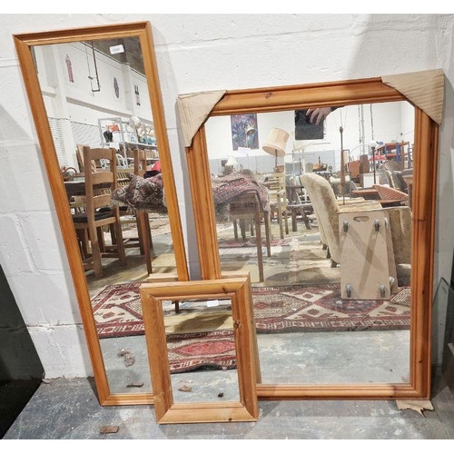 1245 - Modern pine rectangular wall mirror, 107cm x 74.5cm and two other smaller wall mirrors (3)