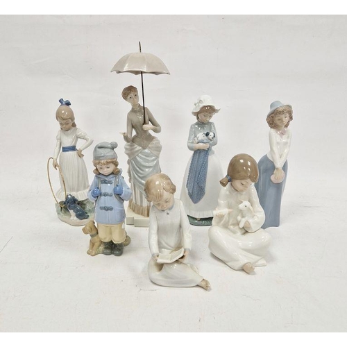 13 - Seven Nao figures including lady with parasol and various children (7)