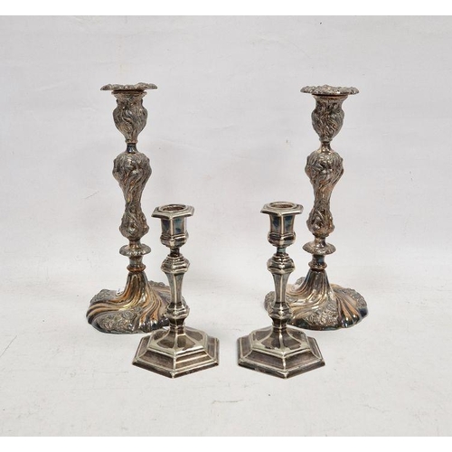 201 - Pair of silver-plated candlesticks, relief decorated with birds amongst branches, 29cm high and a pa... 