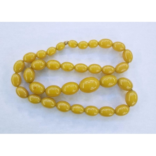 218 - String of butterscotch yellow graduated amber beads, 70cm long approx.