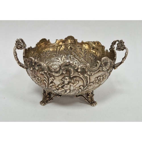 237 - 19th century foreign silver circular-shaped two-handled dish, repousse decorated with cherubs, flora... 