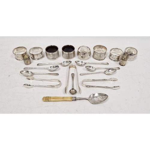 255 - Assorted silver napkin rings, teaspoons, sugar nips, etc