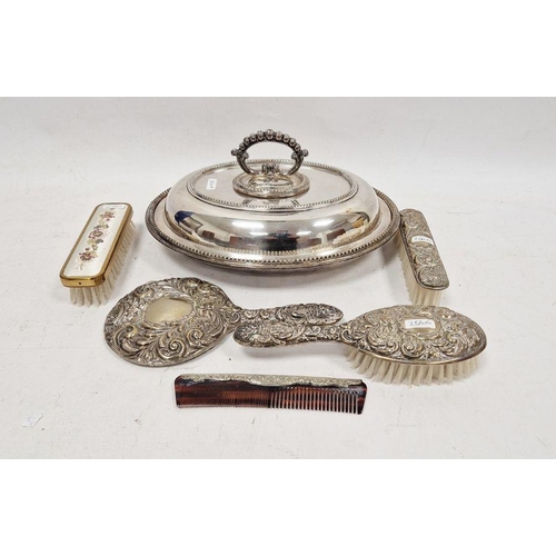 256 - Silver-filled repousse mounted three-piece dressing table set of comb, brush and mirror, two other d... 