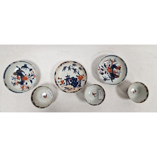 76 - Three matched Japanese Imari pattern tea bowls and saucers, each with decoration depicting pagodas a... 