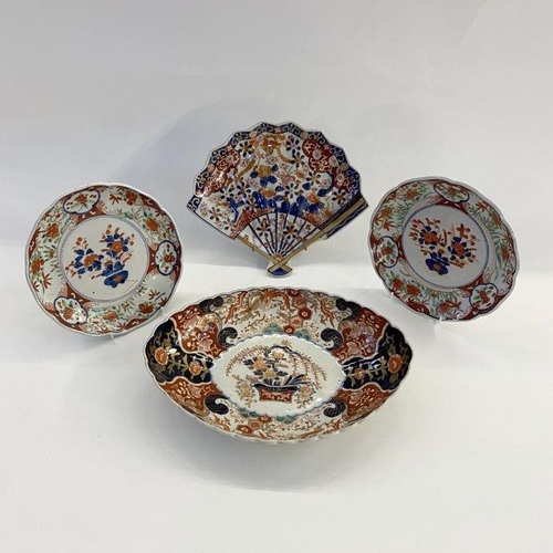 78 - Japanese Imari porcelain dish, oval and scalloped, centred by boughpot and having phoenix and brocad... 