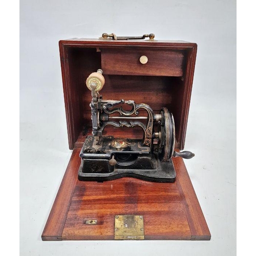 89 - Mid to late 19th century sewing machine by James Weirs, in mahogany cabinet with accessories, 28cm h... 