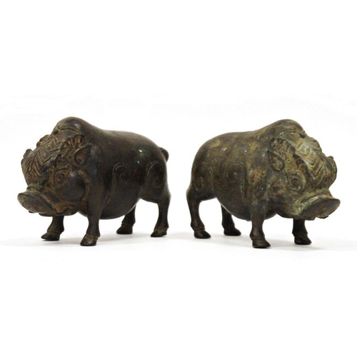 110 - Pair of chinese, or possibly Indonesian, bronze standing boars, each with patterned headdress, 16cm ... 