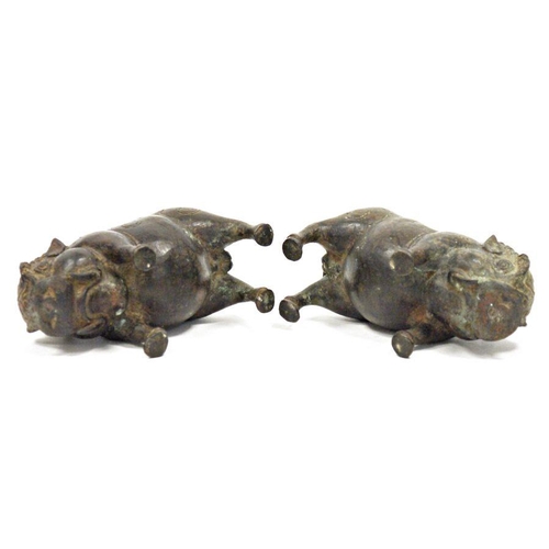 110 - Pair of chinese, or possibly Indonesian, bronze standing boars, each with patterned headdress, 16cm ... 